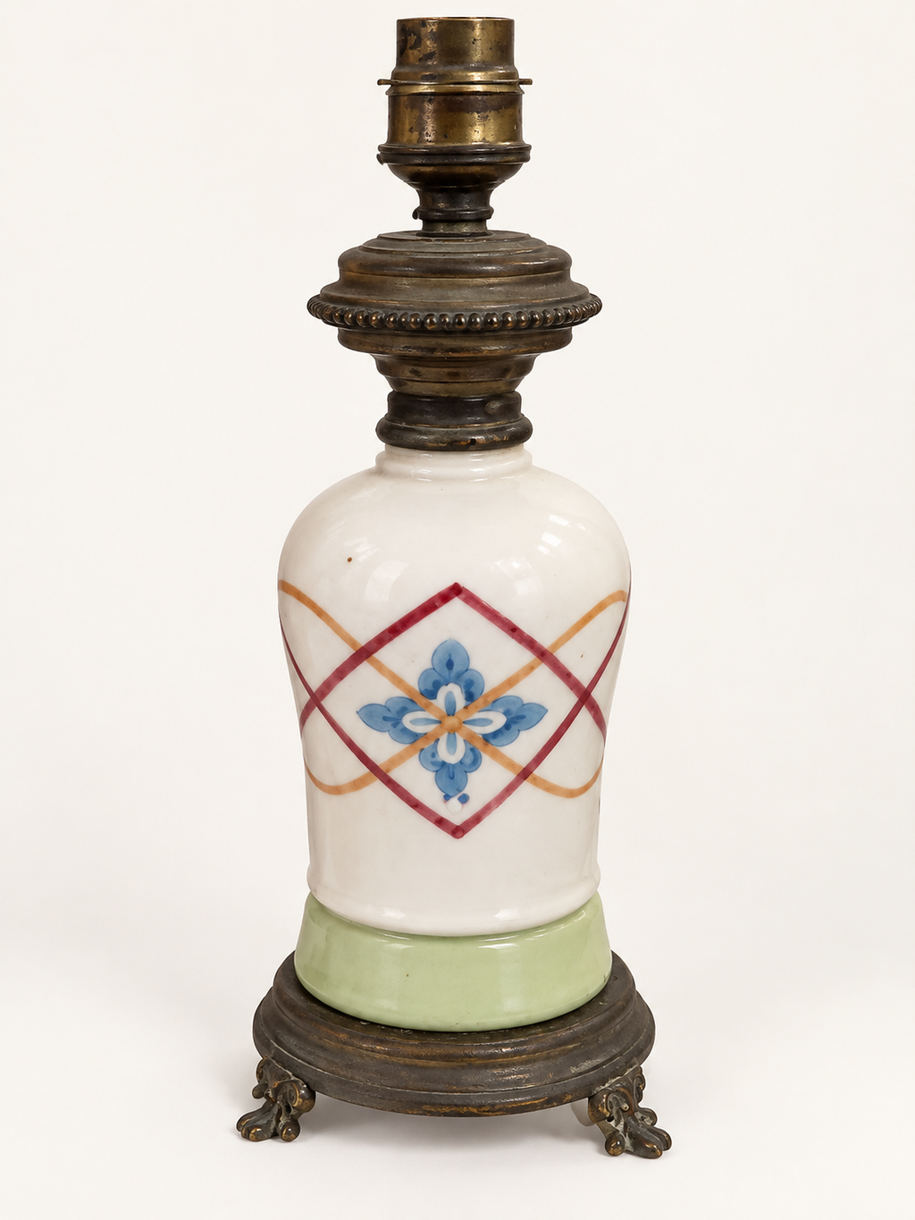 Vintage porcelain oil-lamp base with geometric red and ochre decoration
