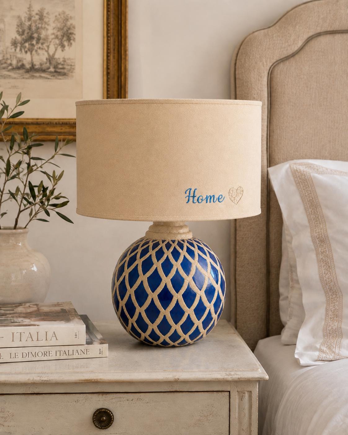 Vintage blue ceramic lamp base photographed with a lampshade for display; lampshade not included.