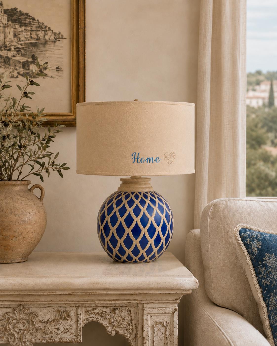 Vintage blue ceramic lamp base photographed with a lampshade for display; lampshade not included.