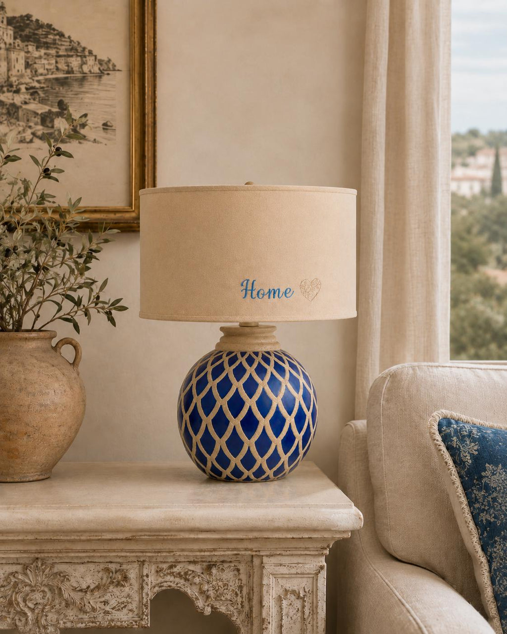 Vintage blue ceramic lamp base photographed with a lampshade for display; lampshade not included.