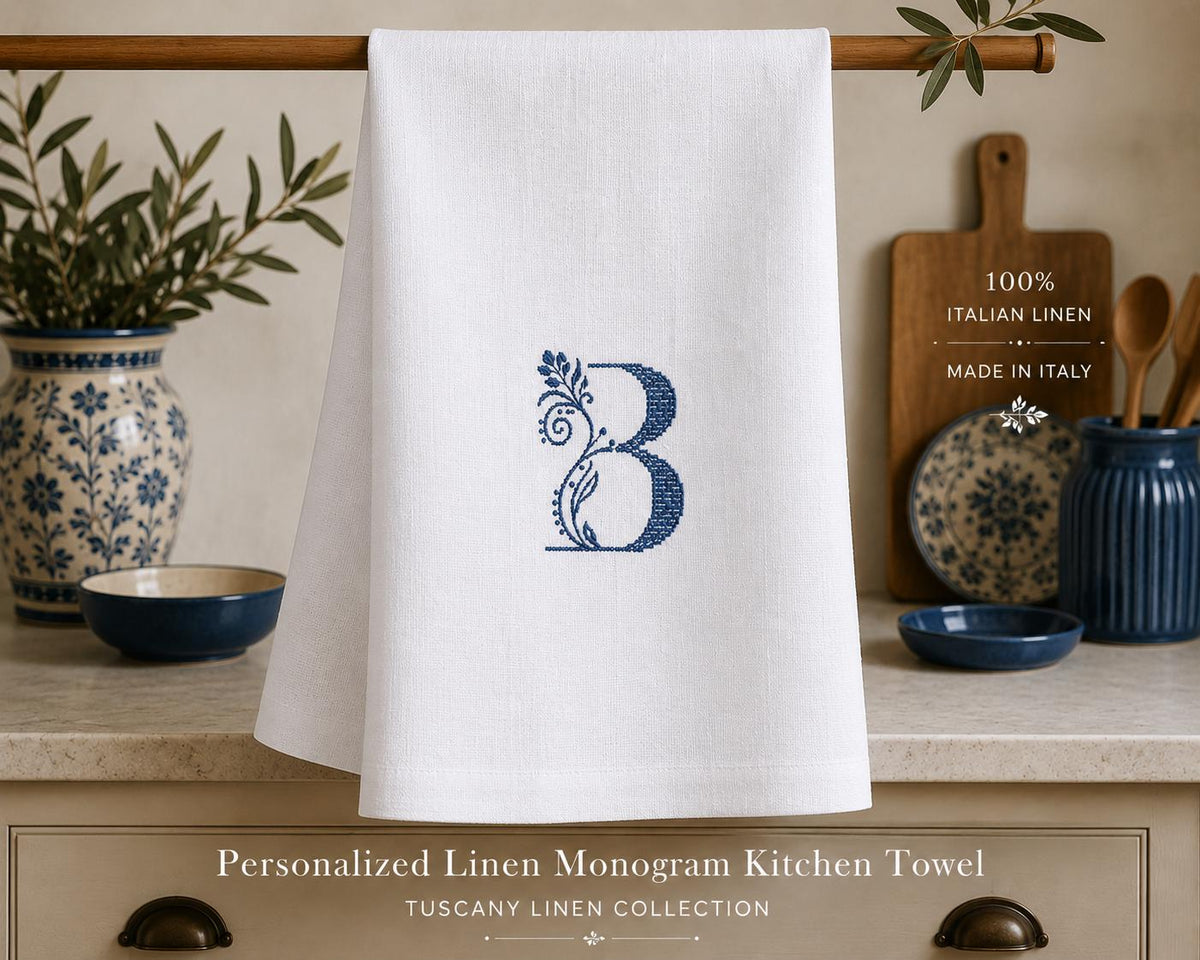 White Italian linen kitchen towel with blue embroidered botanical B monogram, 50 × 70 cm