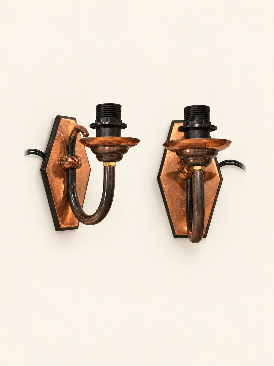 Pair of vintage copper wall sconces, three-quarter view